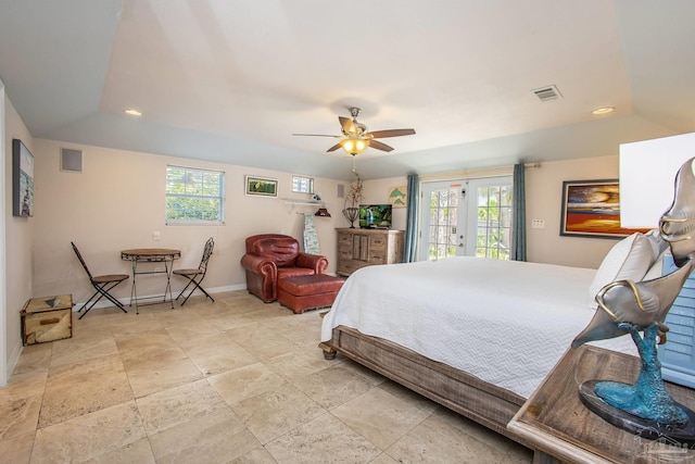 tiled bedroom featuring ceiling fan, access to exterior, french doors, and multiple windows