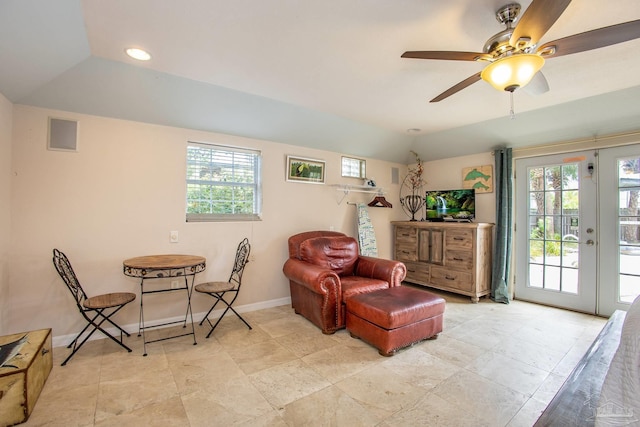 living area featuring ceiling fan, french doors, and light tile patterned floors