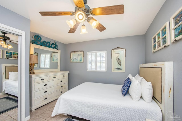 bedroom featuring ceiling fan and light tile patterned floors