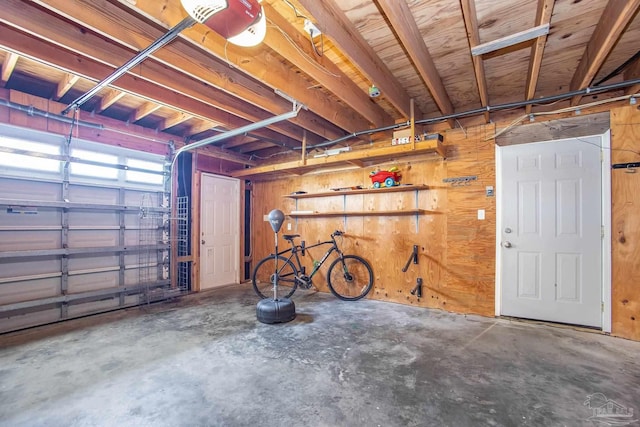 garage featuring wooden walls