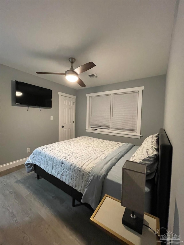 bedroom with hardwood / wood-style flooring and ceiling fan