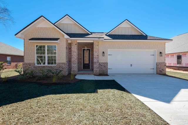 view of front of house with a garage and a front yard