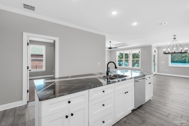 kitchen featuring white cabinets, a kitchen island with sink, sink, wood-type flooring, and dishwasher