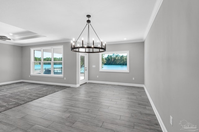 unfurnished dining area with crown molding, hardwood / wood-style flooring, and a notable chandelier