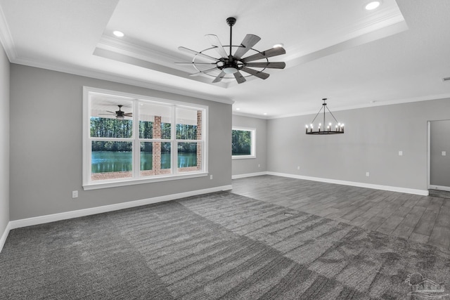 unfurnished living room featuring a tray ceiling and crown molding