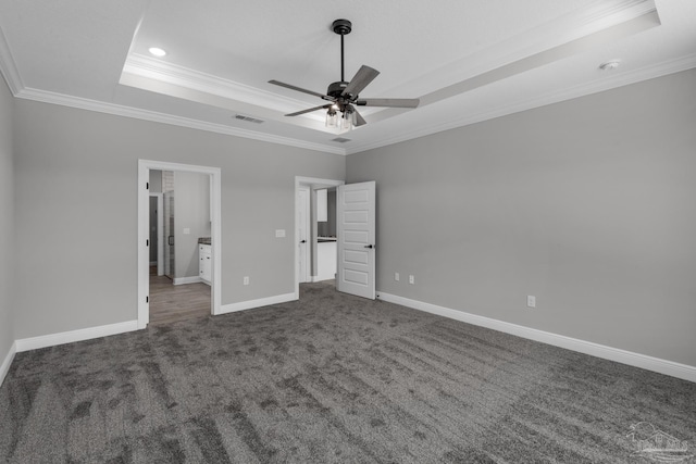 unfurnished bedroom with a raised ceiling, ceiling fan, and crown molding