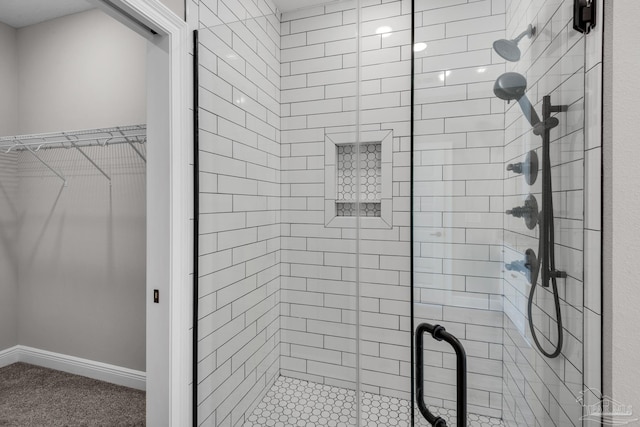 bathroom with a shower with shower door