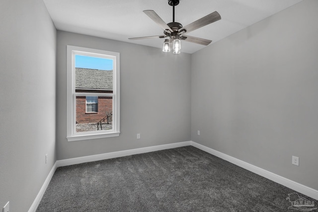 carpeted empty room featuring ceiling fan