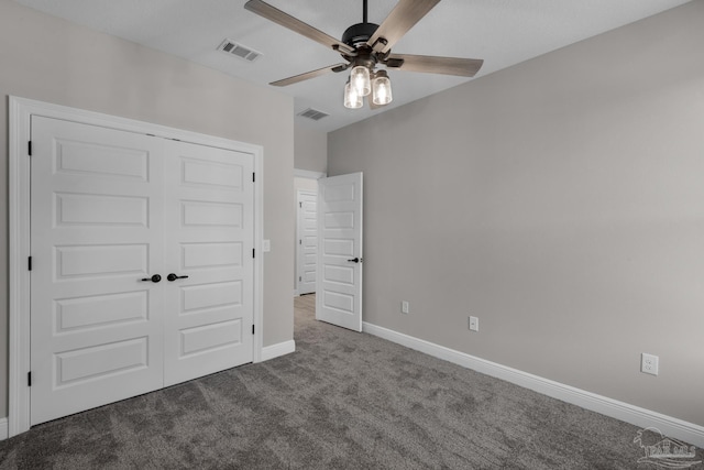 unfurnished bedroom with carpet, a closet, and ceiling fan