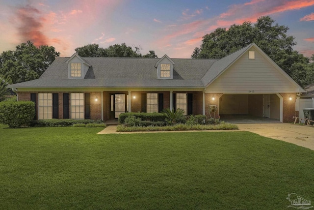 5405 Ilex Ln, Pensacola, FL 32526 - cape cod home with brick siding, a front yard, and driveway
