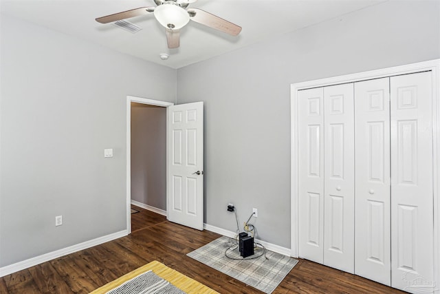 3640 Schifko Rd, Cantonment, FL 32533 - unfurnished bedroom with a closet, wood finished floors, baseboards, and a ceiling fan