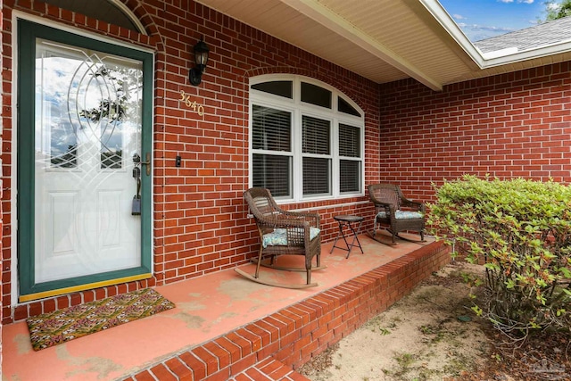 3640 Schifko Rd, Cantonment, FL 32533 - property entrance with a porch and brick siding