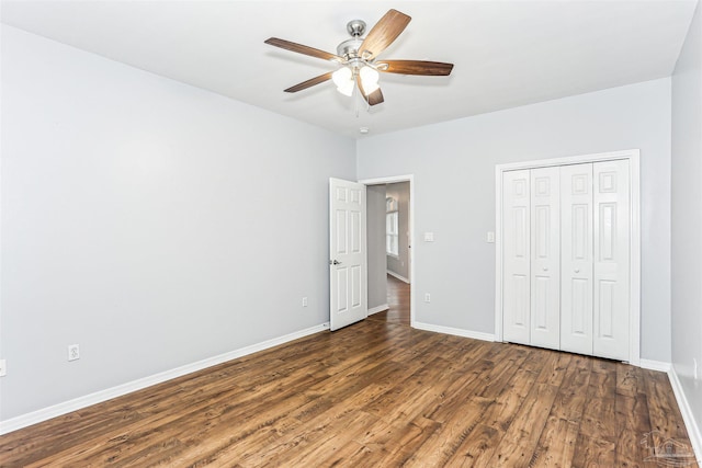 3640 Schifko Rd, Cantonment, FL 32533 - unfurnished bedroom with wood finished floors, baseboards, a closet, and ceiling fan