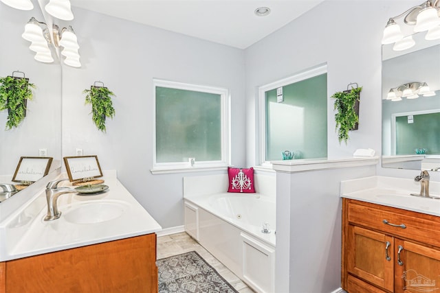 3640 Schifko Rd, Cantonment, FL 32533 - full bathroom with two vanities, a tub with jets, and a chandelier