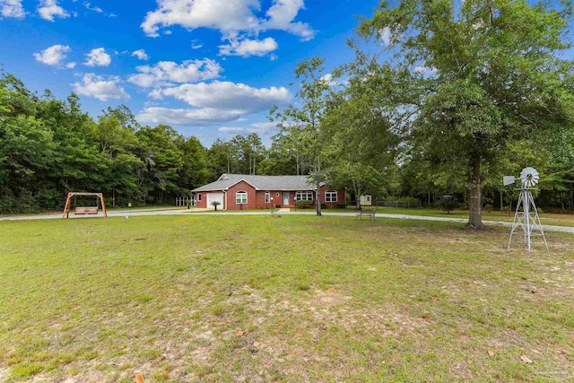 3640 Schifko Rd, Cantonment, FL 32533 - view of front of home with a front lawn and a garage