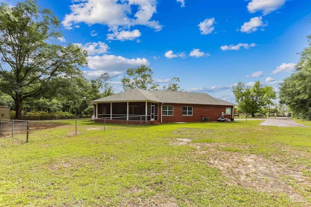 3640 Schifko Rd, Cantonment, FL 32533 - back of property with a sunroom and brick siding