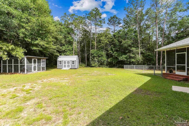 3640 Schifko Rd, Cantonment, FL 32533 - view of yard featuring a sunroom, an outdoor structure, and a shed
