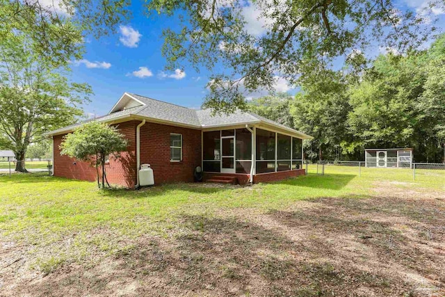 3640 Schifko Rd, Cantonment, FL 32533 - back of house featuring a sunroom and brick siding