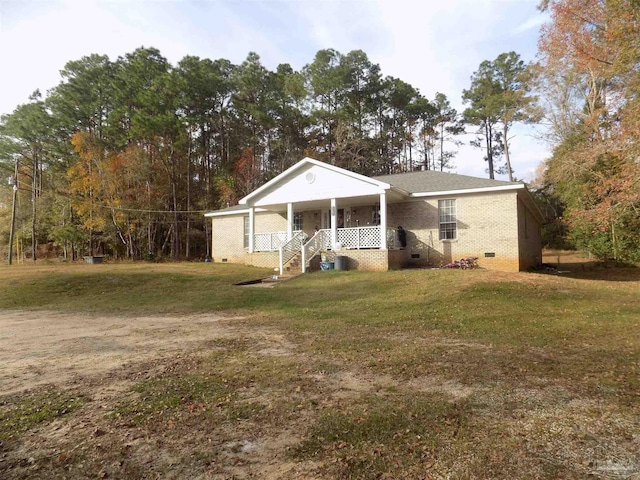 view of front of house with a porch and a front yard