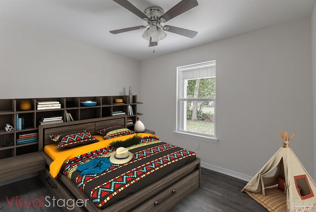 bedroom featuring dark wood-style flooring, a ceiling fan, and baseboards