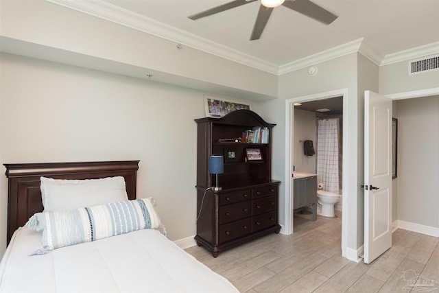 bedroom with ornamental molding, light hardwood / wood-style floors, ceiling fan, and ensuite bathroom