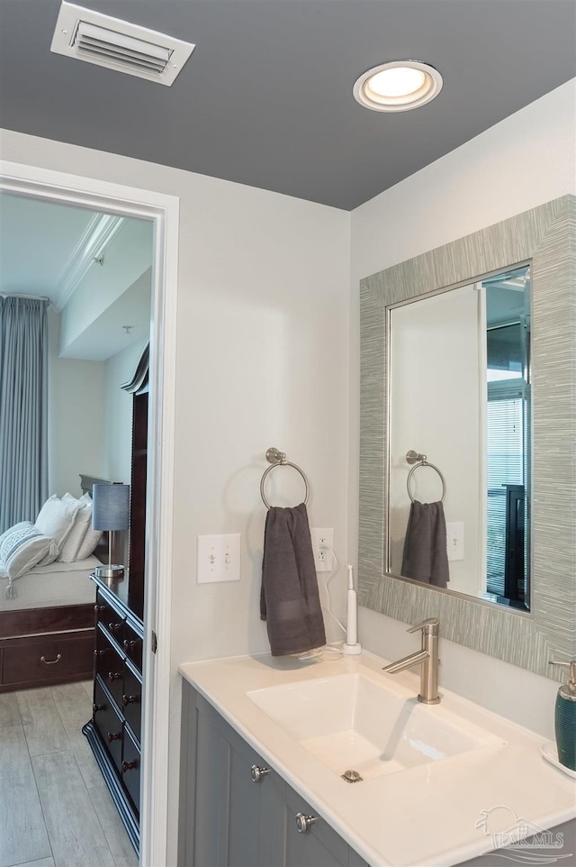 bathroom with visible vents and vanity