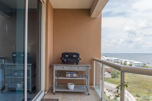 balcony featuring a water view