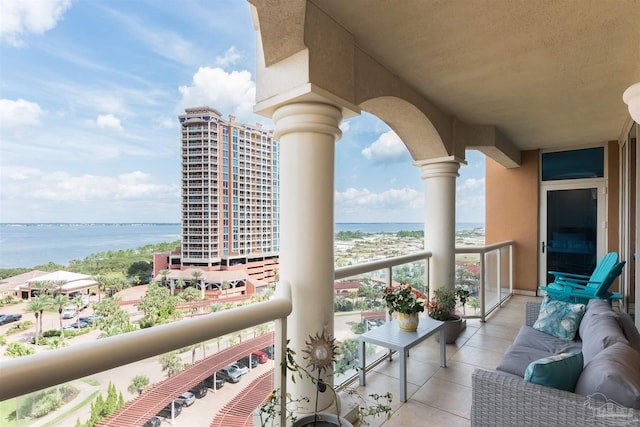 balcony featuring a water view