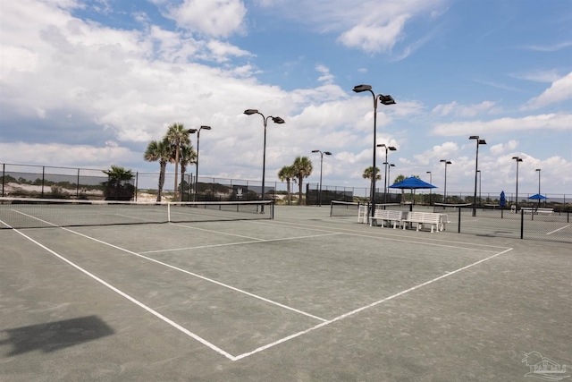 view of sport court with fence