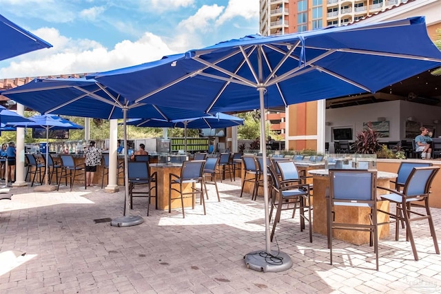 view of patio / terrace featuring an outdoor bar