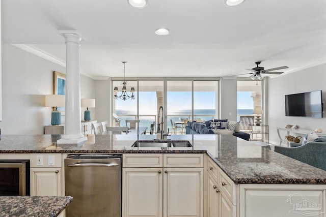 18 Via Deluna Dr Unit 603, Pensacola Beach, FL 32561 - kitchen featuring open floor plan, crown molding, decorative columns, ceiling fan, and dark stone counters