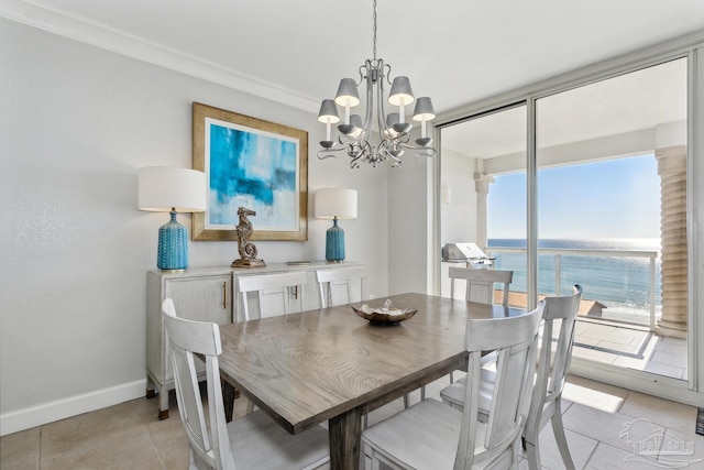18 Via Deluna Dr Unit 603, Pensacola Beach, FL 32561 - dining room featuring light tile patterned floors, a chandelier, a water view, and ornamental molding
