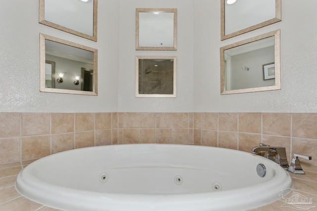 18 Via Deluna Dr Unit 603, Pensacola Beach, FL 32561 - full bathroom with a jetted tub and a textured wall