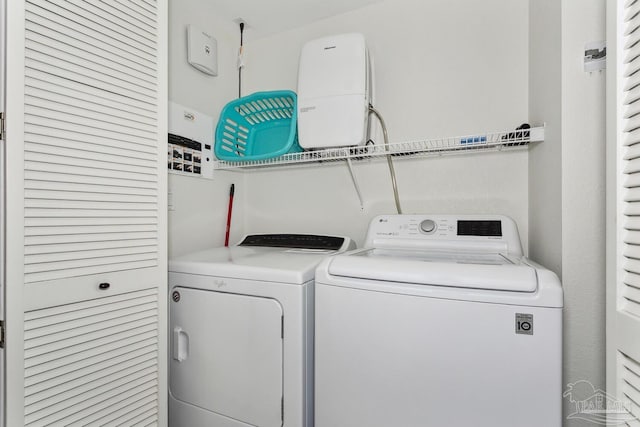 18 Via Deluna Dr Unit 603, Pensacola Beach, FL 32561 - laundry area with washing machine and clothes dryer