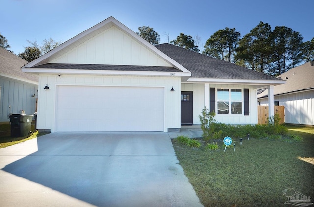 view of front facade with a front yard and a garage