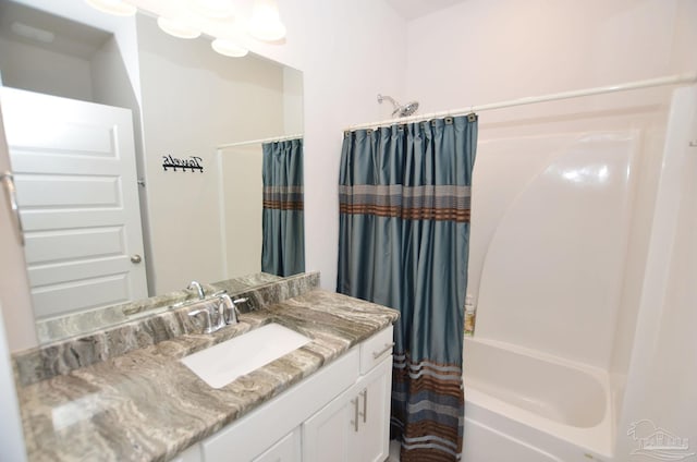 bathroom with shower / bath combination with curtain and vanity