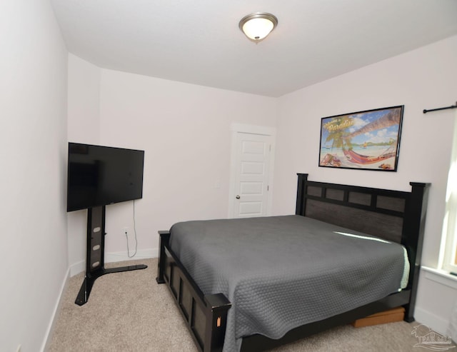 bedroom featuring light colored carpet