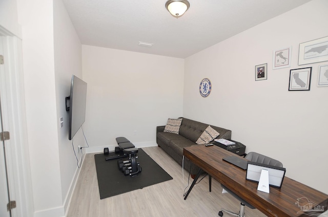 home office with light wood-type flooring