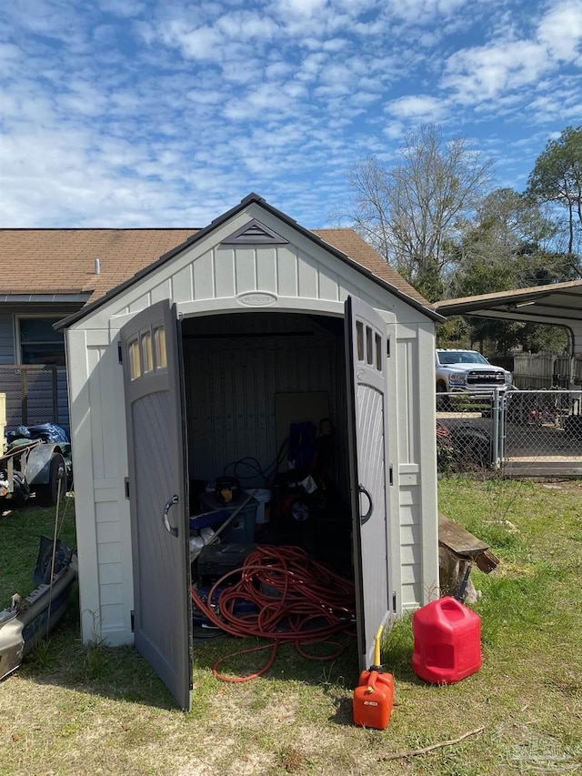 view of shed with fence