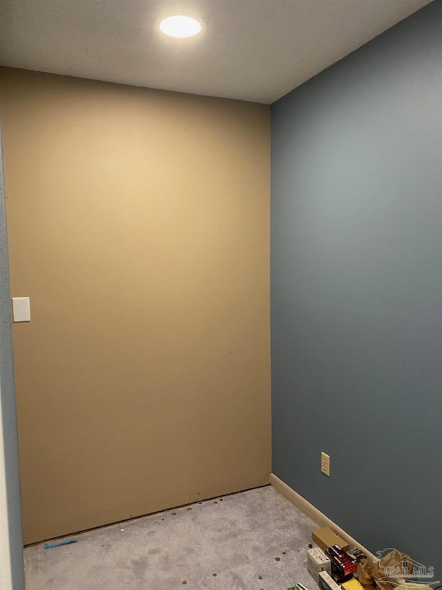 unfurnished room featuring light colored carpet