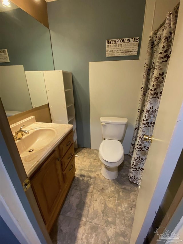 bathroom with vanity and toilet