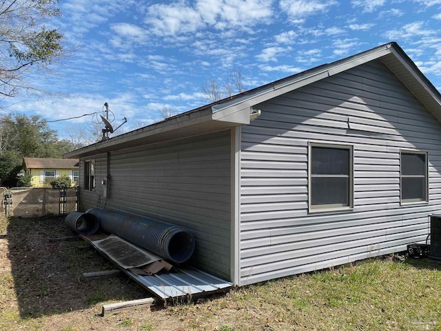 view of property exterior with fence