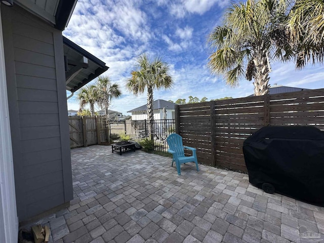 view of patio featuring a fire pit and area for grilling