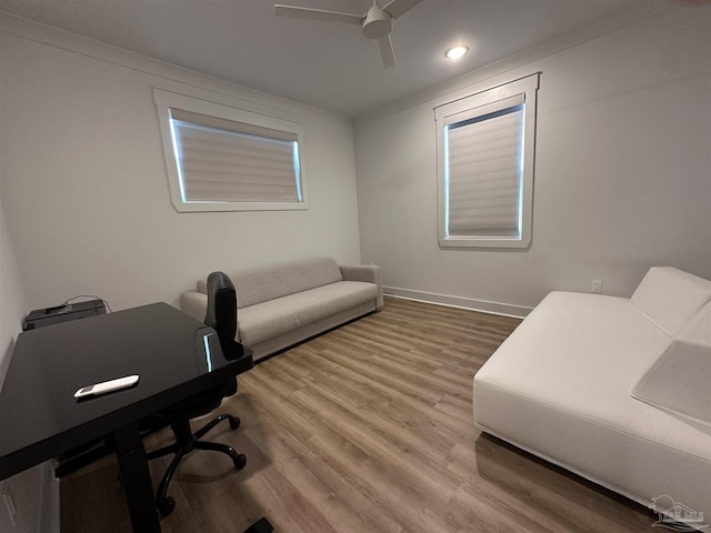 office area featuring ceiling fan, crown molding, and hardwood / wood-style floors