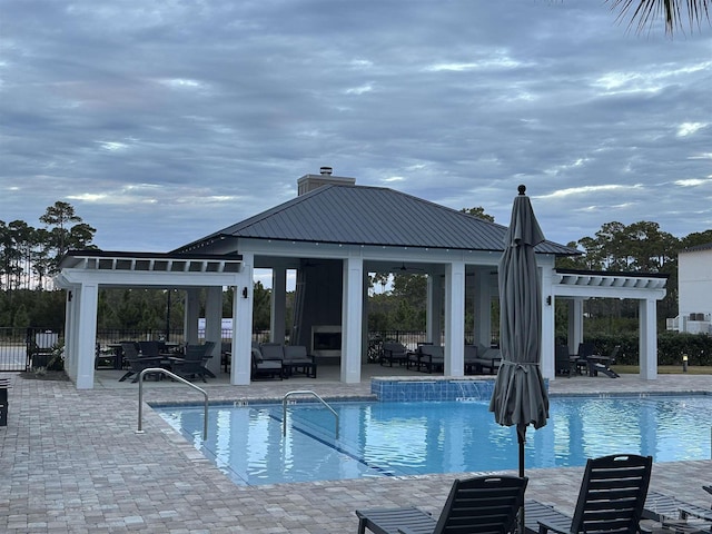 view of swimming pool with a patio area and a gazebo