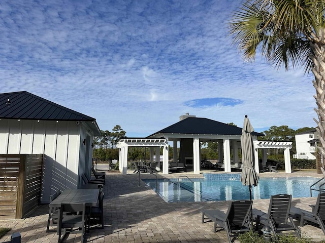 view of swimming pool featuring a pergola, a gazebo, and a patio