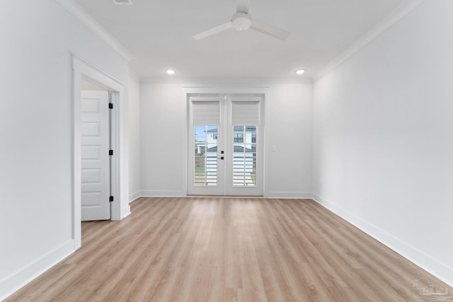 spare room with light wood-type flooring, ceiling fan, crown molding, and french doors