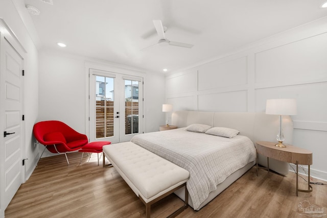 bedroom with wood-type flooring, french doors, access to exterior, ceiling fan, and crown molding