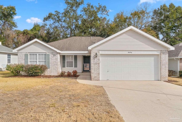 ranch-style home featuring a garage and a front yard