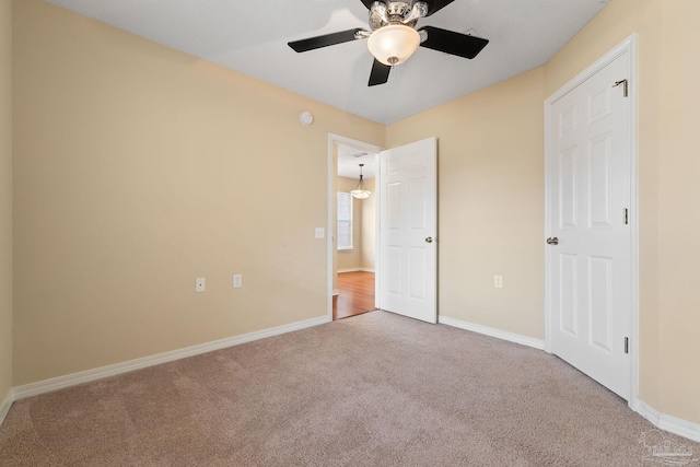 unfurnished bedroom with ceiling fan and carpet flooring